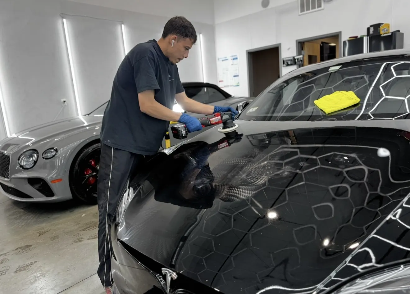 Black Tesla Model S hood machine paint correction pricing example Secret Touch Auto Spa Shrewsbury MA