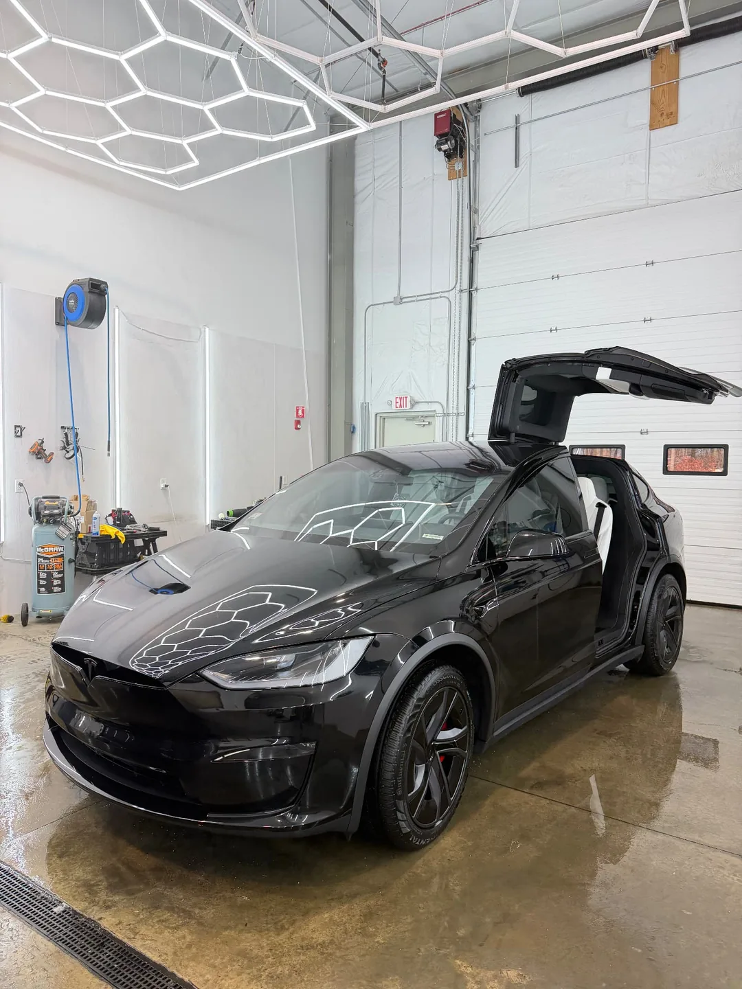 Tesla Model X ceramic coated finish in the shop at Secret Touch Auto Spa Shrewsbury MA