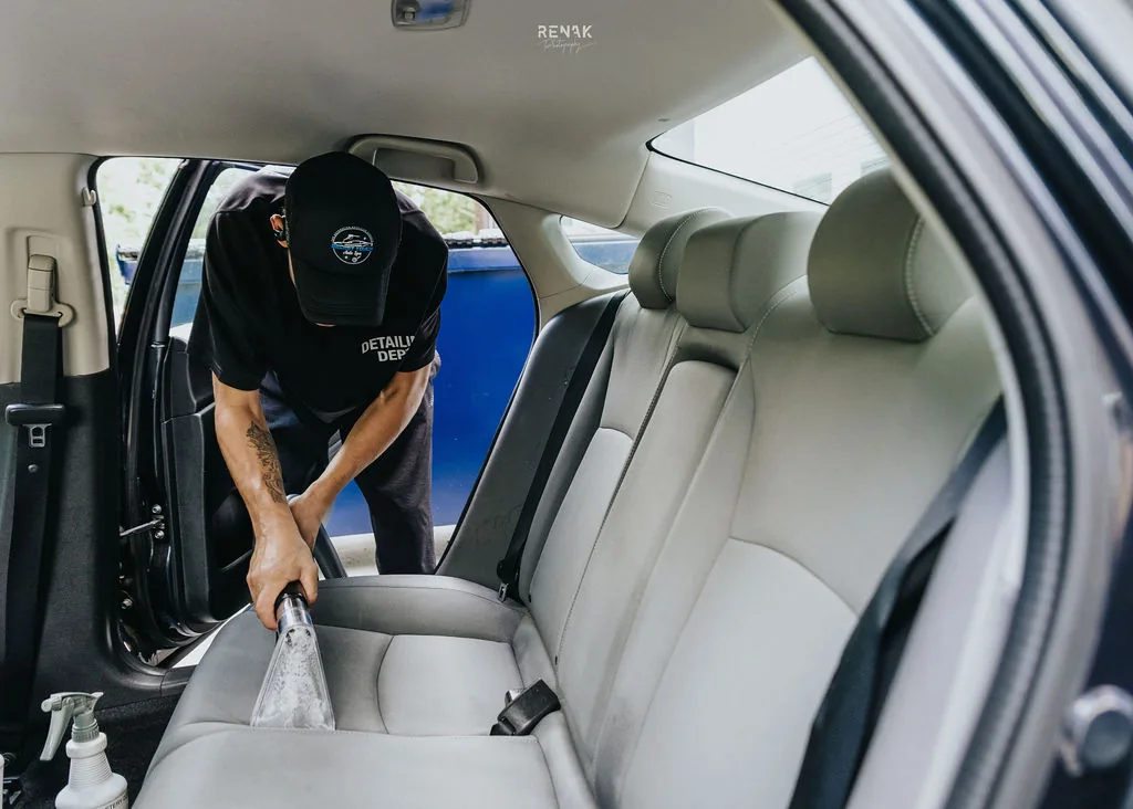 Freshly detailed luxury sedan in Secret Touch Auto Spa detailing bay Shrewsbury MA